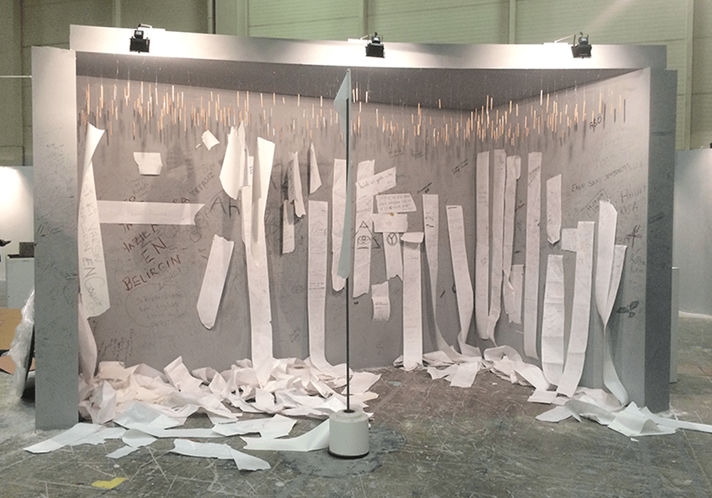 Installation Contents / İçindekiler: paper strips falling from a wall of pencils, Dark Utopia, 2017