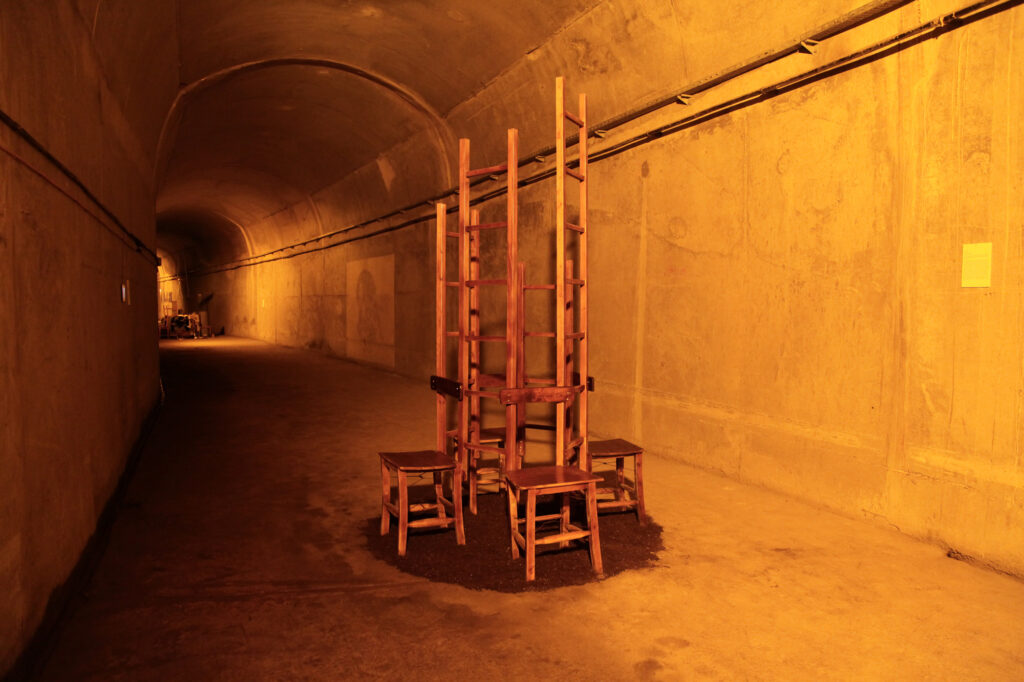 View down the tunnel towards the stacked chairs of Meeting