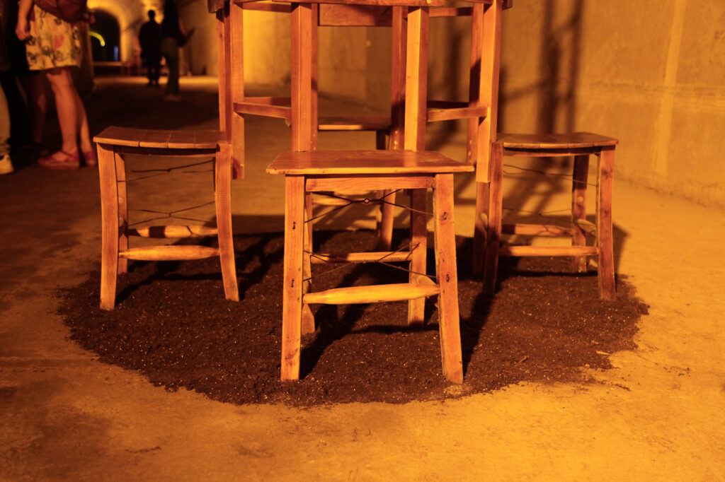 Close-up of the chairs at the base of the sculpture Meeting