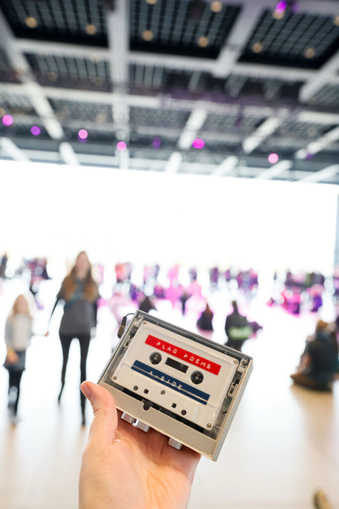 Hand holding the f leg cassette tape at the Neue Nationalgalerie, Berlin